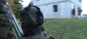 attach identification patches to the helmets of soldiers